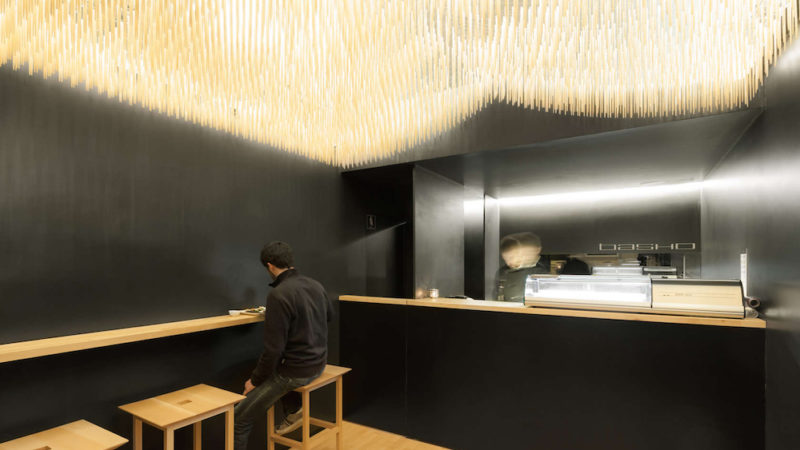 basho sushi bar in portugal features flying chopsticks on ceiling