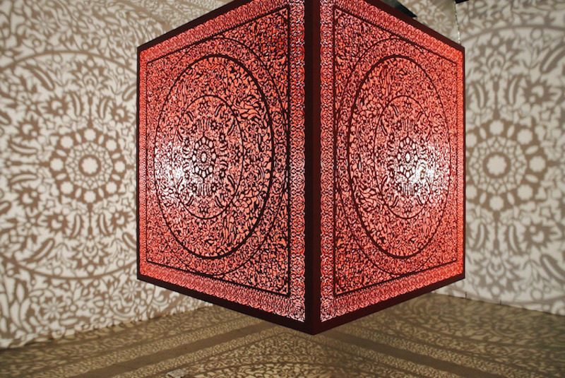 floating cube by anila quayyum agha casts incredible shadows