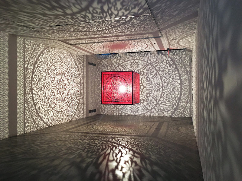 floating cube by anila quayyum agha casts incredible shadows