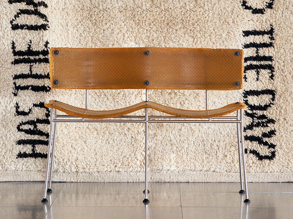 'XR Mesh 2-seater (orange)', 2025 by LS Gomma with 'Has The Day Invaded The Night? Has the Night Invaded The Day?' (2009) by Louise Bourgeois, from Christopher Farr