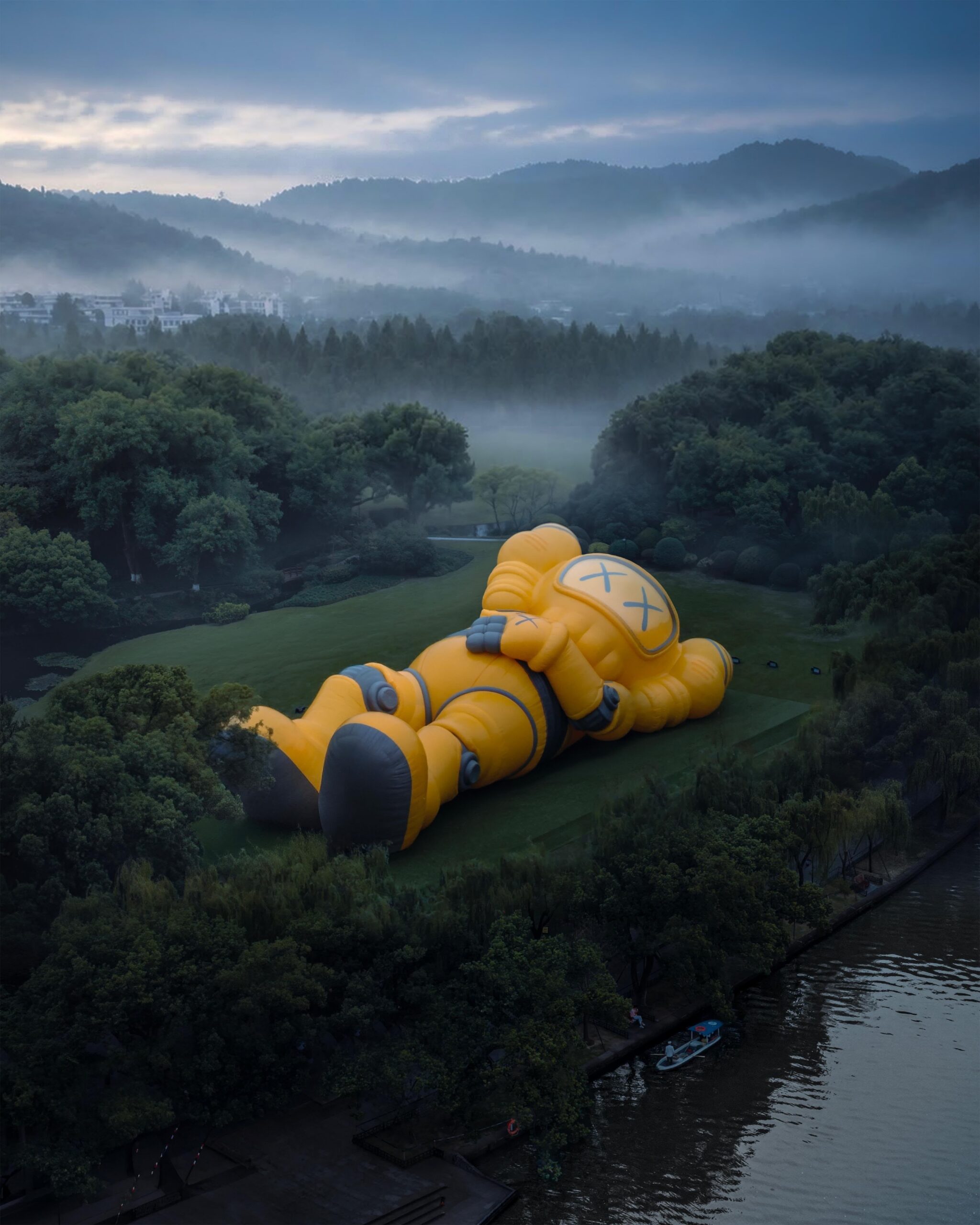 Aerial view of the 30-meter osmanthus-yellow robotic COMPANION reclining on the lawns of Orioles Singing in the Willows, West Lake, Hangzhou