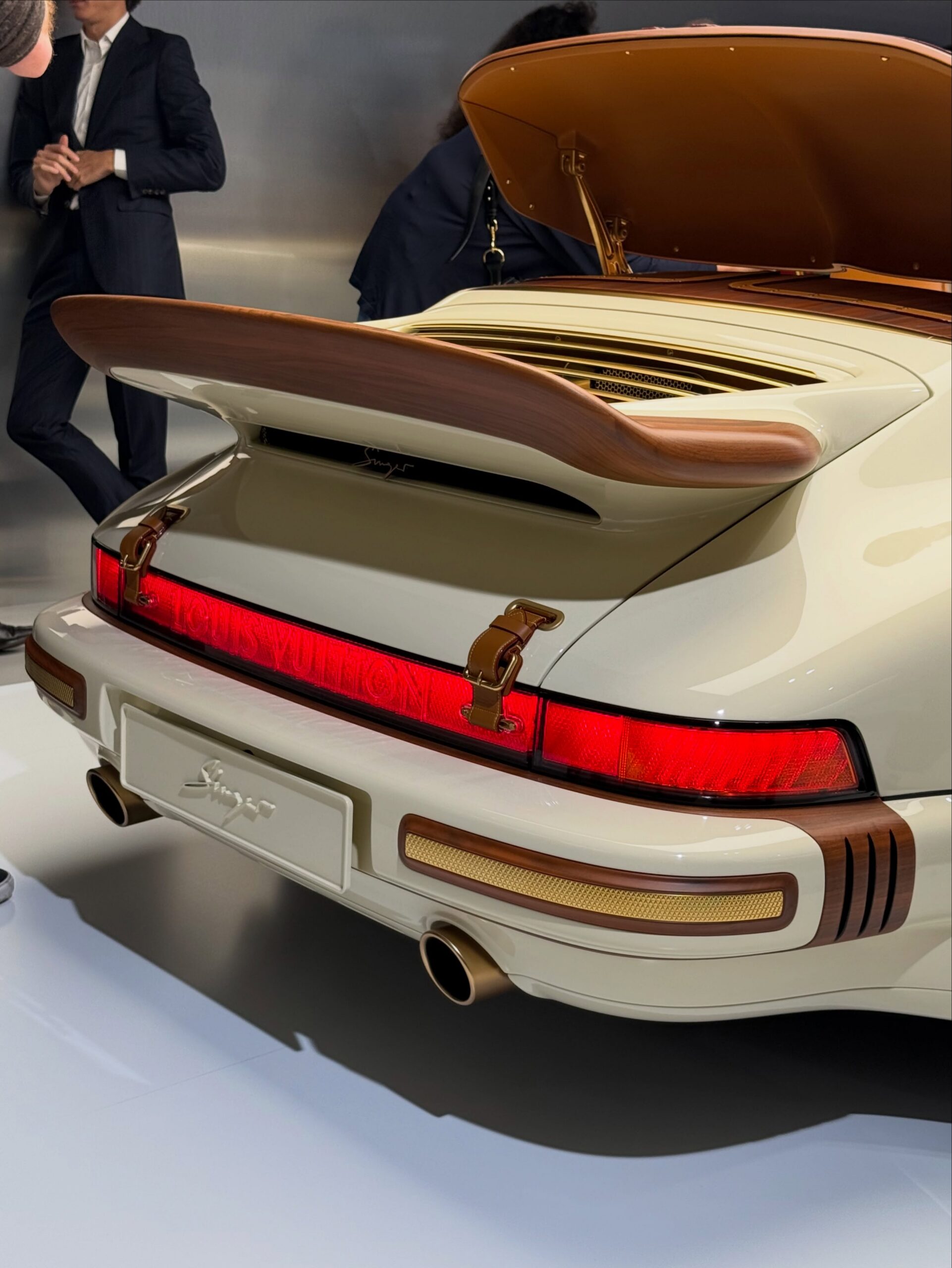 Rear of the cream 911 with wood trimmed spoiler and Louis Vuitton taillight bar