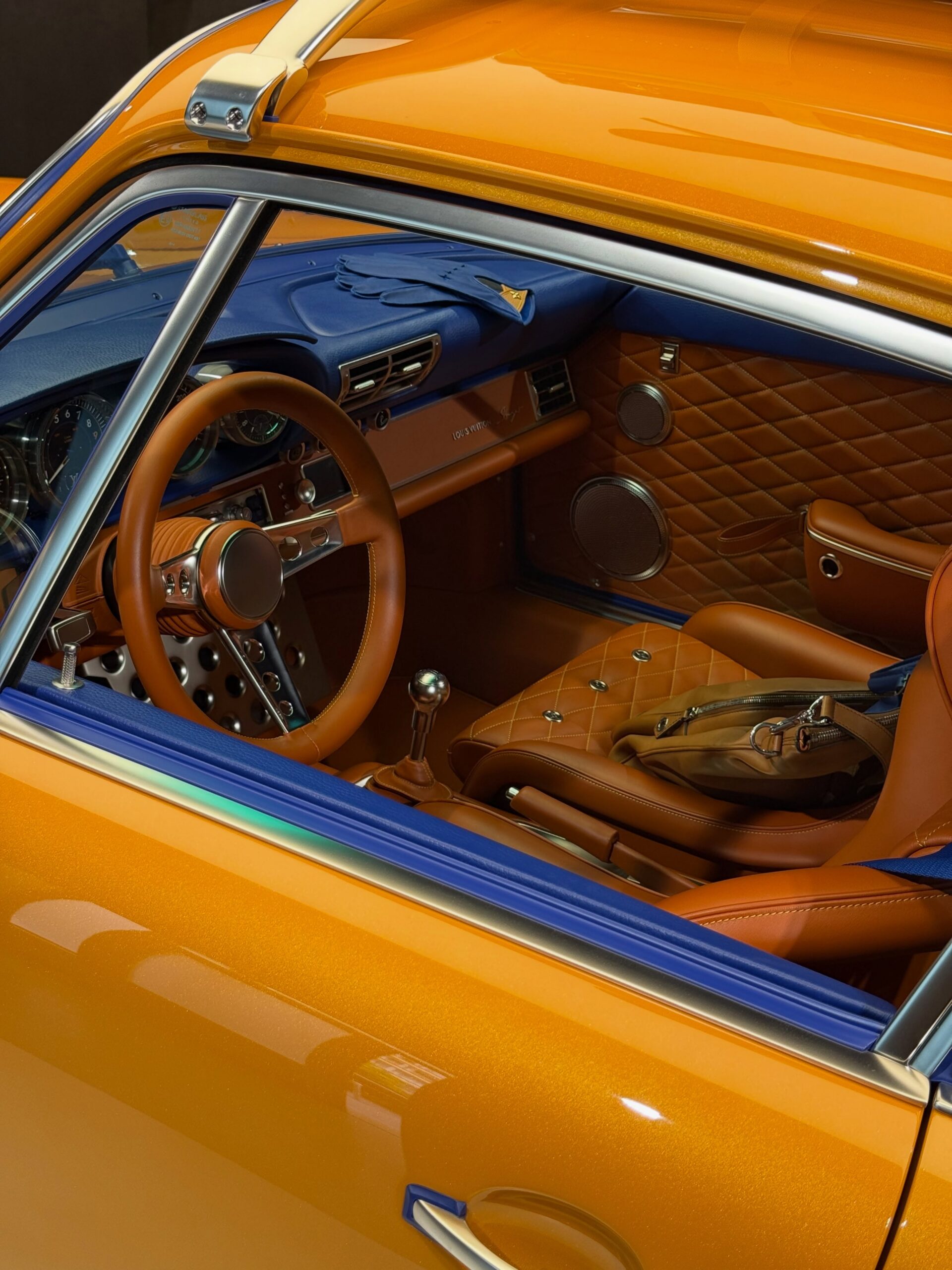 Blue and tan quilted leather interior of the orange 911