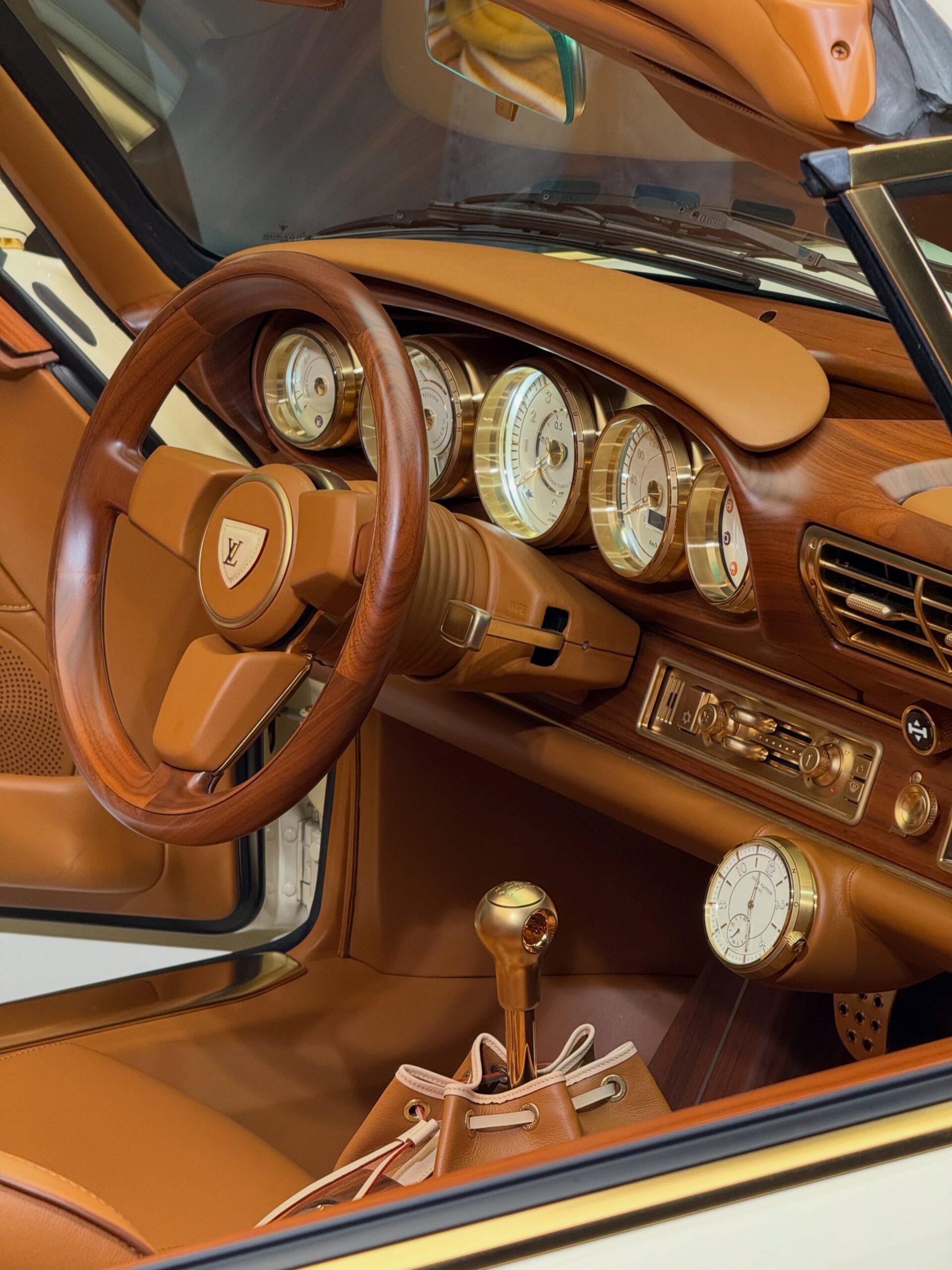 Wood and leather cabin with LV shield steering wheel